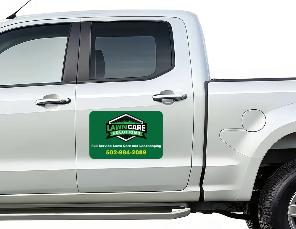 custom car magnet on silver truck with lawn care solutions branding